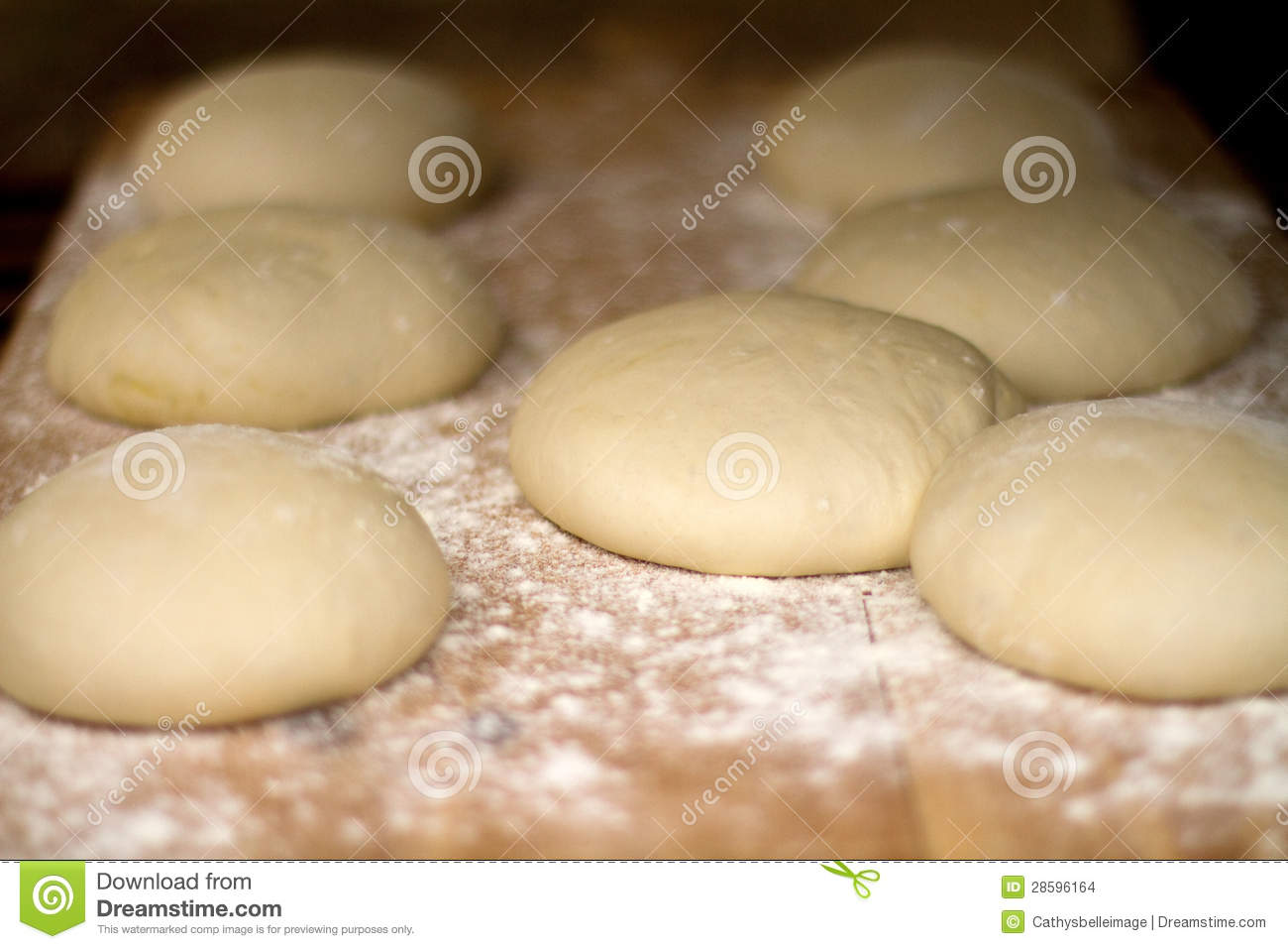 Balls Of Dough On Wooden Board Ready To Be Baked
