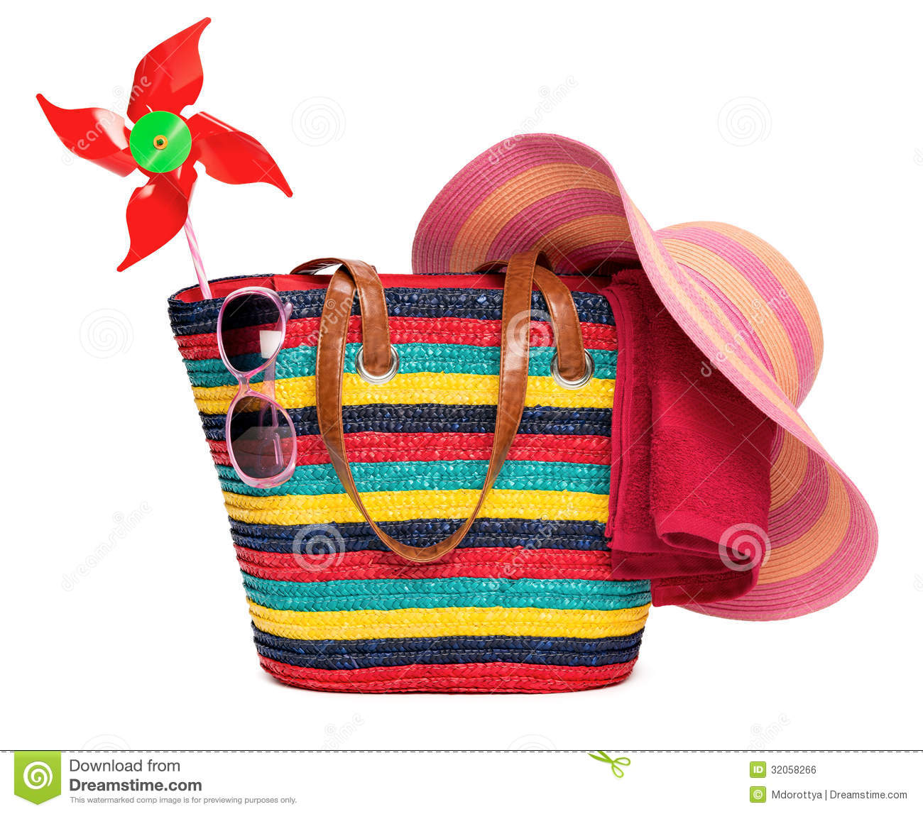 Colorful Striped Beach Bag With A Straw Hat Towel Sunglasses And A