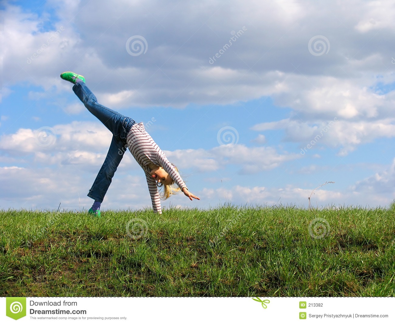 Somersault On Grass On The Sky Clouds Background