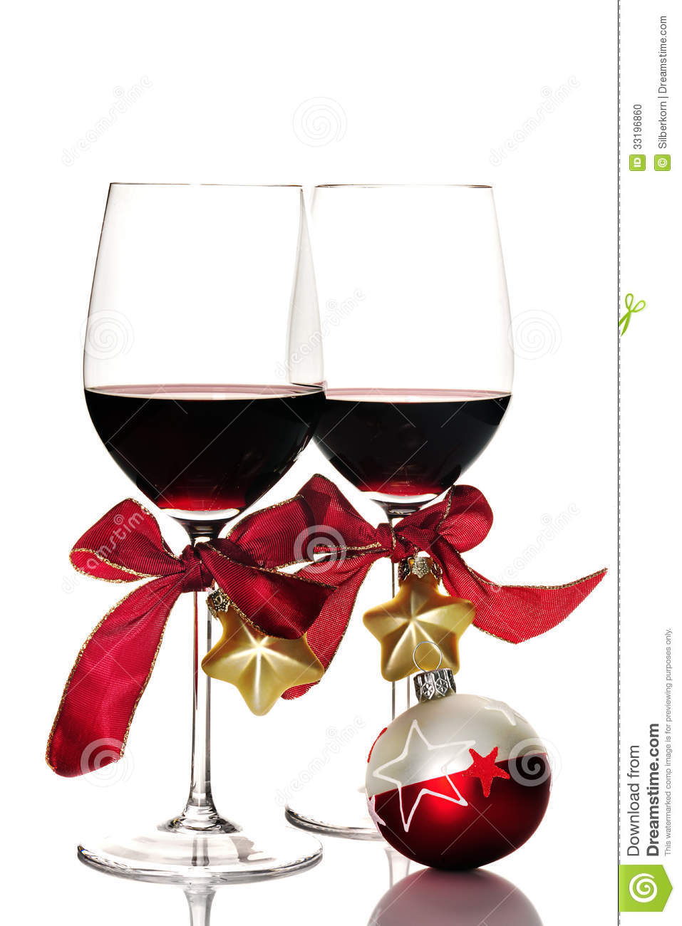 Two Glasses Of Red Wine And Christmas Ornaments Isolated On White