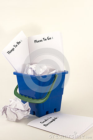 Bucket Filled With Wadded Up Paper And Sheets Listing Things To Do