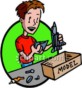 Boy Building A Model Rocket   Royalty Free Clipart Picture