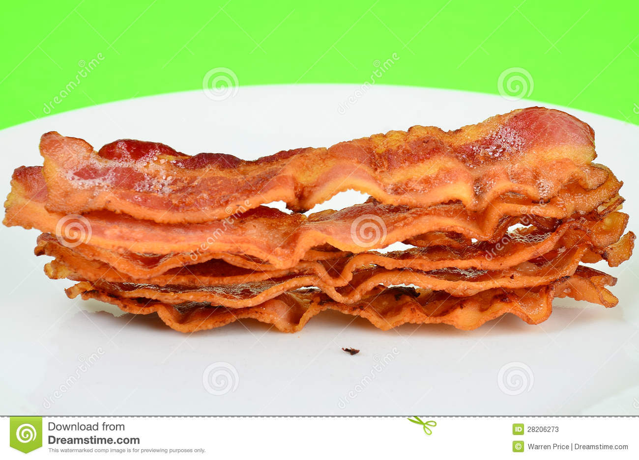 Closeup Of Six Strips Of Bacon Still Sizzling Hot On White Plate With