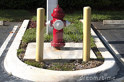 Red Fire Hydrant In Parking Lot With Safety Poles Stock Photos   Image