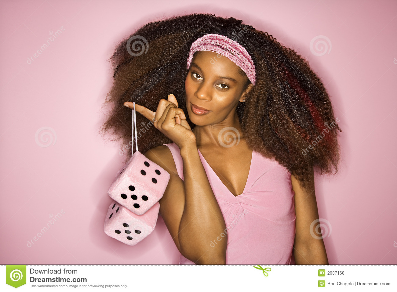 African American Woman Holding Fuzzy Dice  Royalty Free Stock Photos