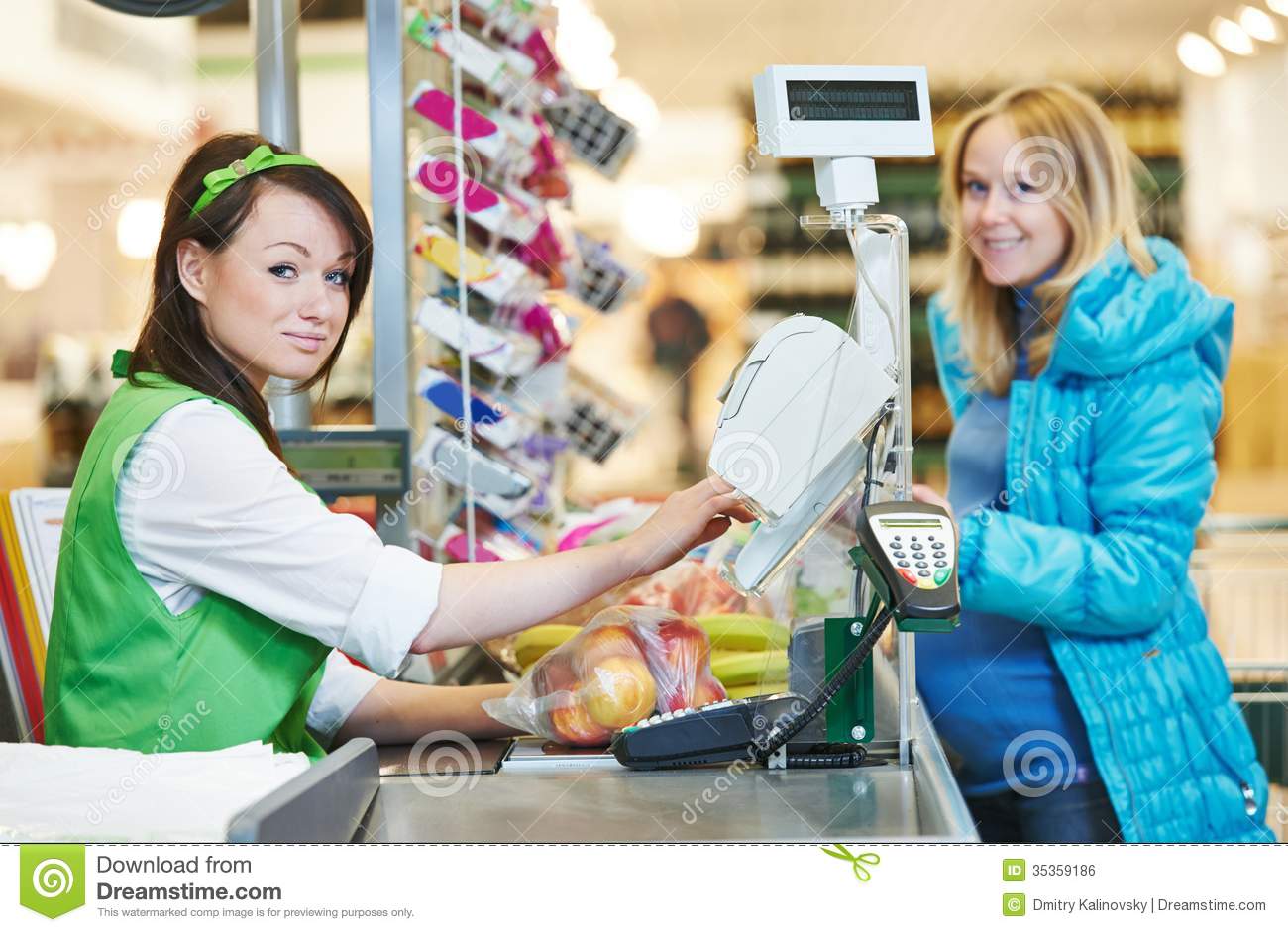 Customer Buying Food At Supermarket And Making Check Out With Cashdesk