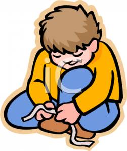 Boy Tying Shoes   Royalty Free Clipart Picture