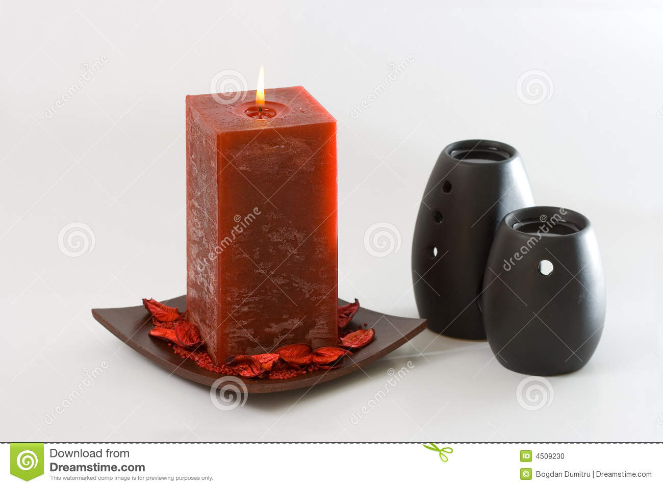 Red Scented Candle And Black Ceramic Aromatic Oil Burners Isolated On    