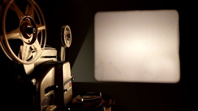 Stock Footage An Antique Mm Film Projector Projects A Blank Movie With