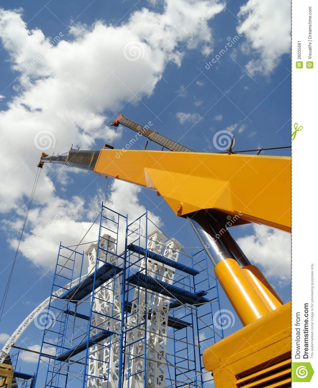 Yellow Boom Of An Hydraulic Crane Mounting A Metallic Structure