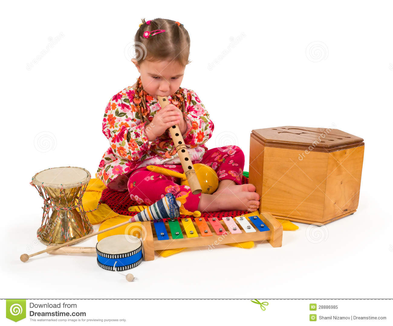 One Small Little Girl Playing On Drum Flute Maraca Xylophone