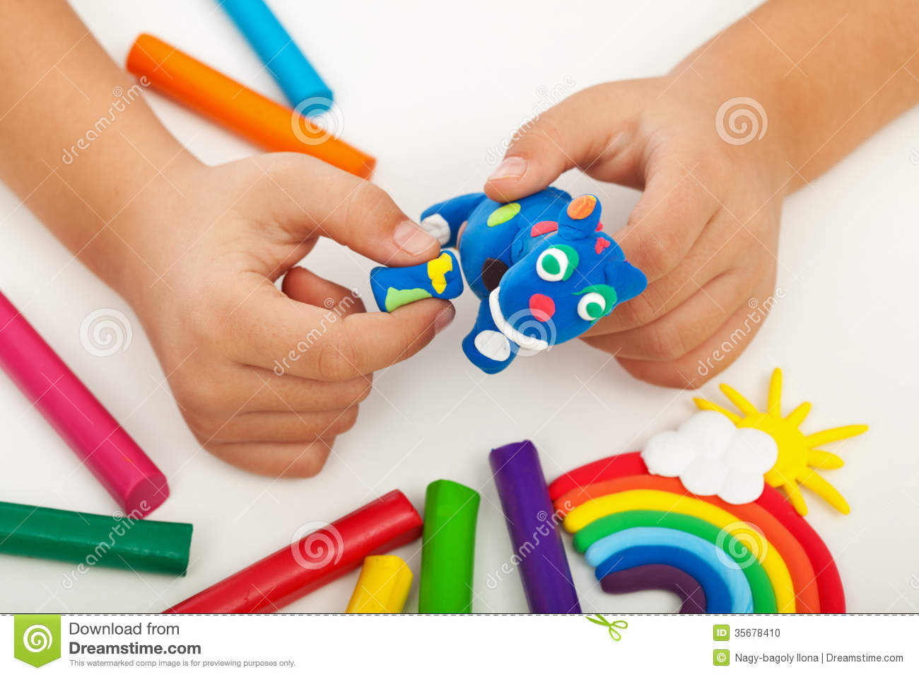 Child Playing With Colorful Clay Making Animal Figures   Closeup On