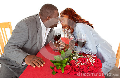 African American Couple About To Kiss In Romantic Dinner Stock Image