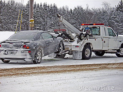 Wrecker Towing A Car In Winter Stock Image   Image  5420911