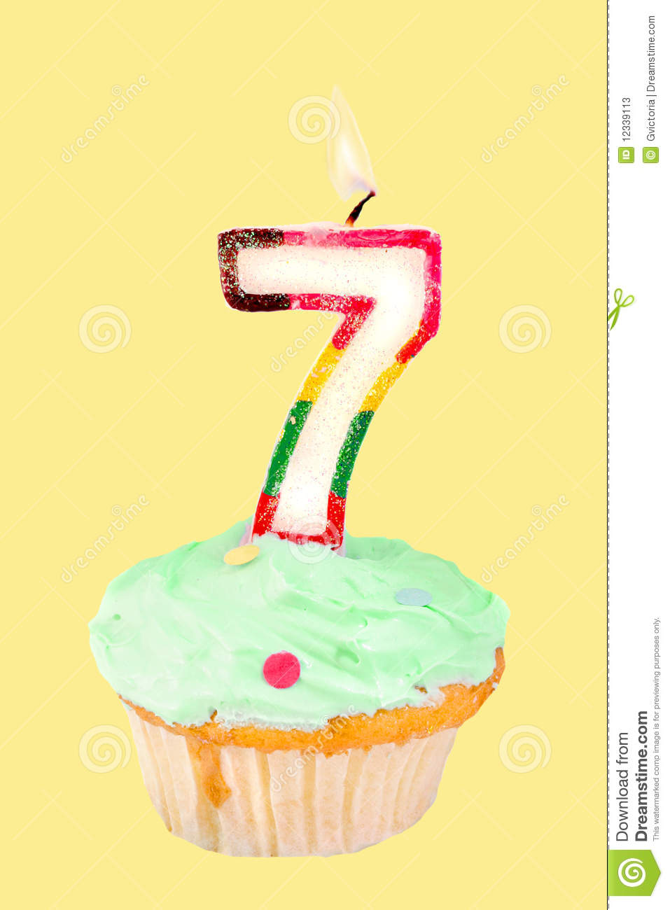 Seventh Birthday Cupcake With Green Frosting On A Yellow Background