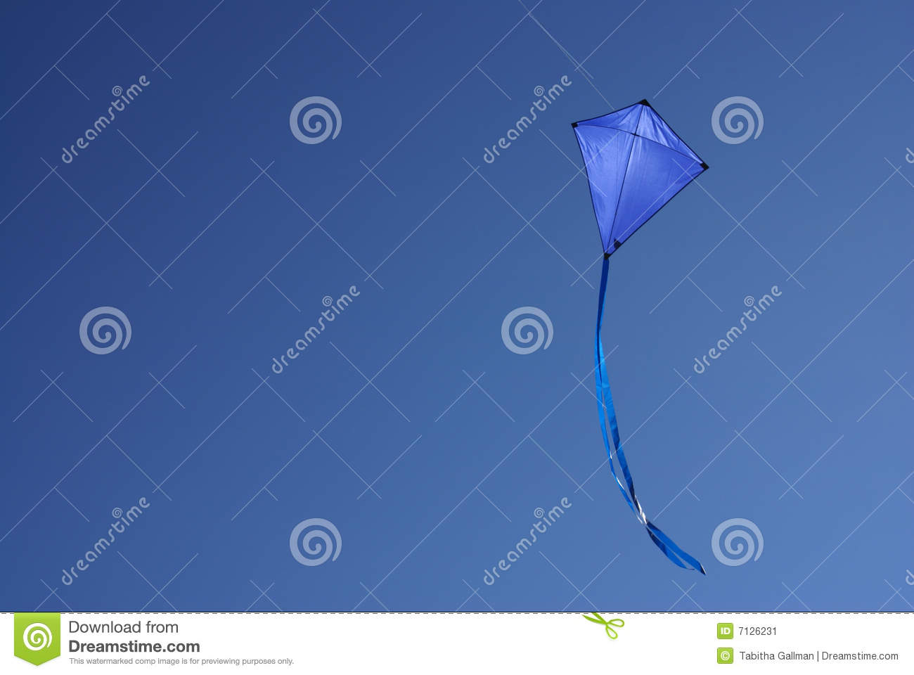 Blue Kite In Clear Blue Sky