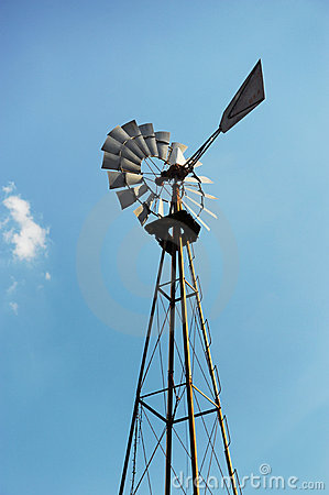 An Old Fashioned Farm Windmill Used To Pump Water