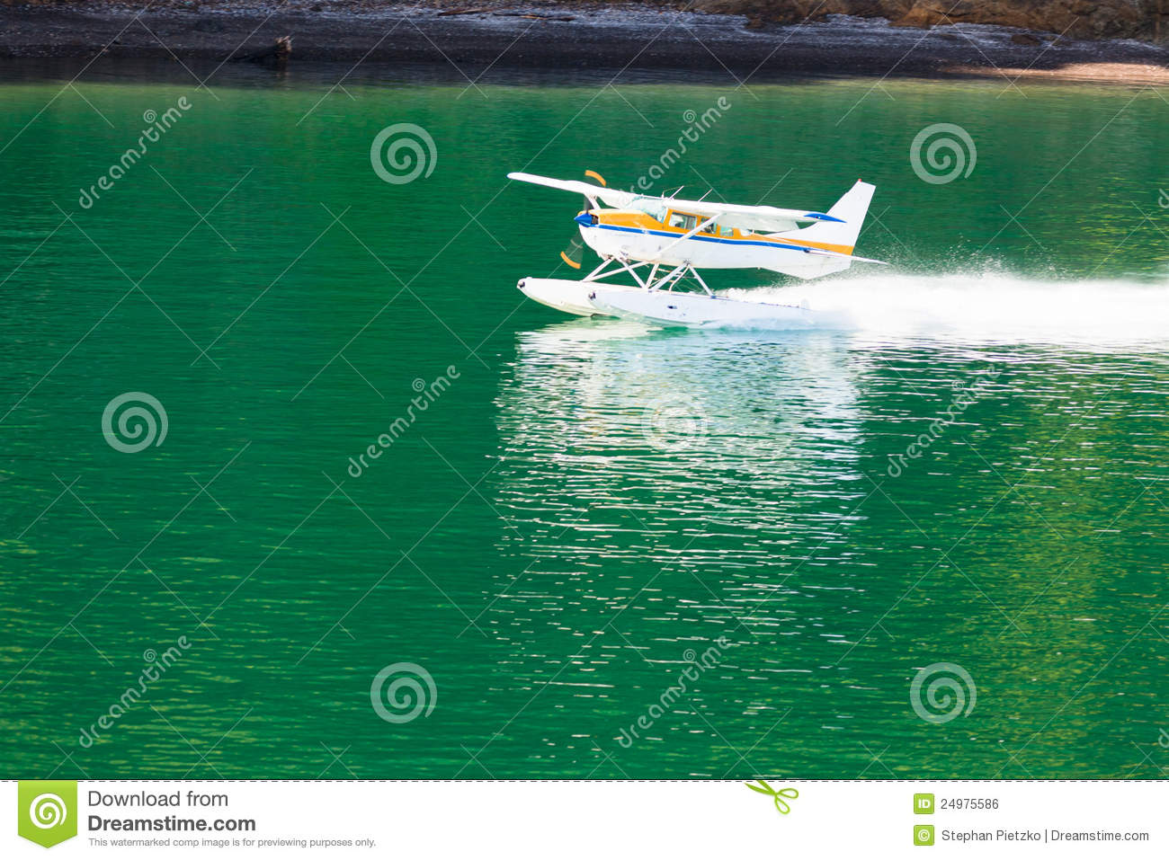 Aircraft Seaplane Taking Off On Calm Water Of Lake Royalty Free Stock