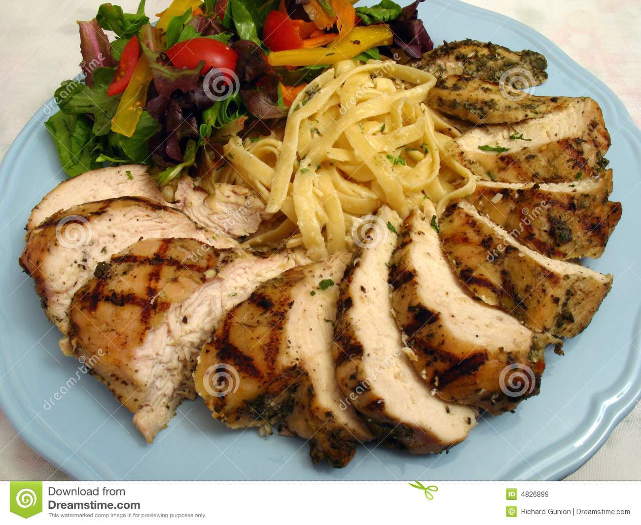 Photo Of Grilled Chicken And Fettuccine Alfredo Dish Served With Salad
