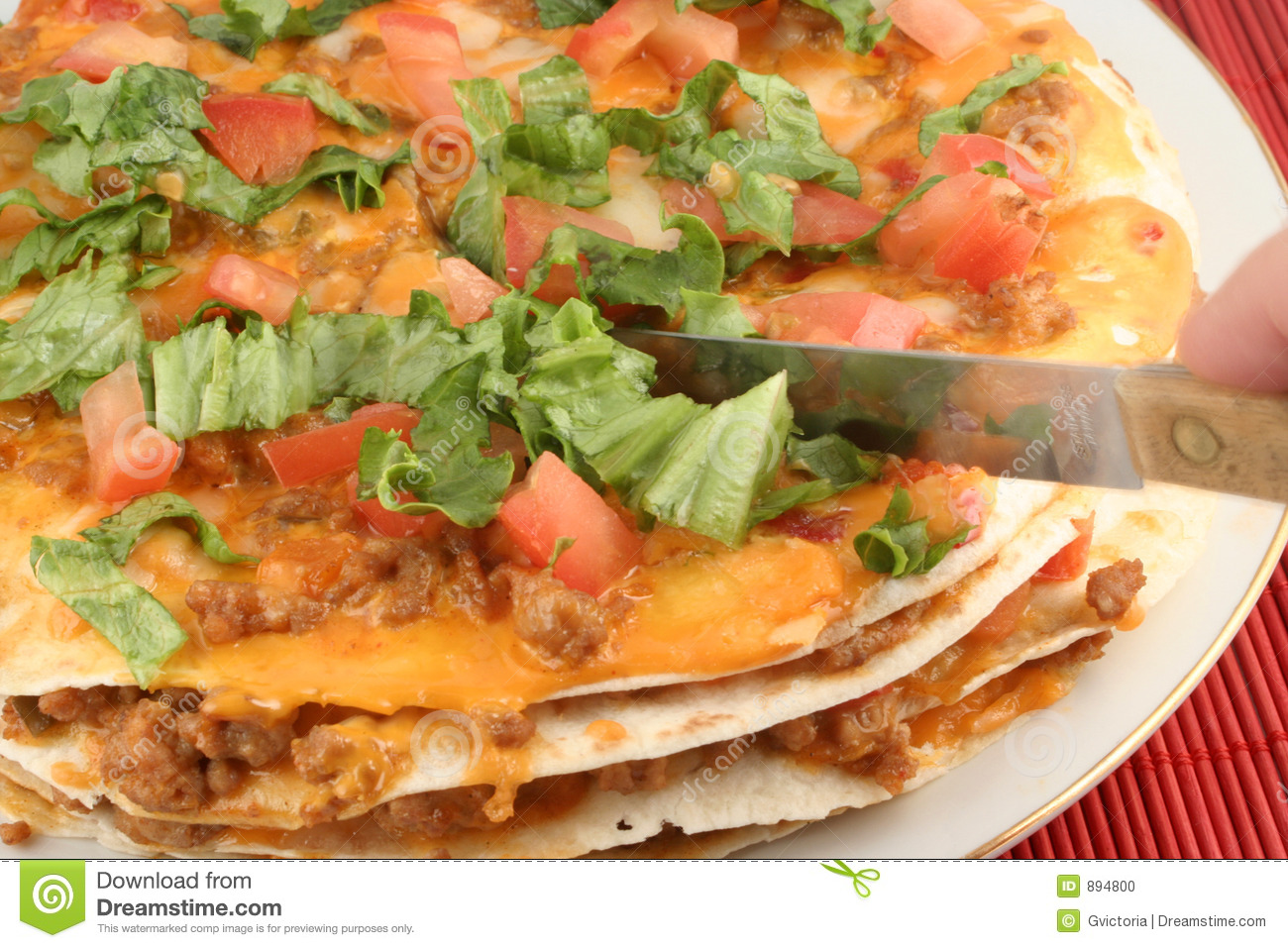 Cutting Into A 4 Layer Soft Taco Mexican Pizza