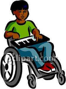 African American Boy In A Wheelchair Playing A Keyboard   Royalty Free