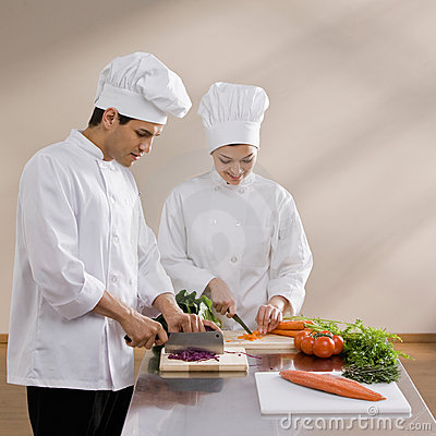 Chefs In Toques Preparing And Chopping Food Stock Photos   Image