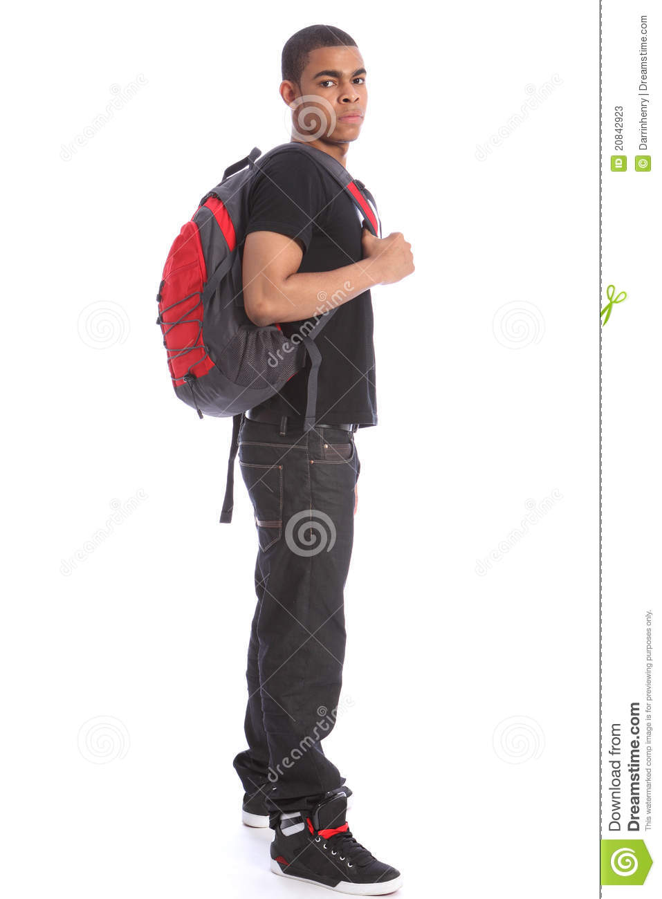 Student Wearing Jeans And T Shirt Standing With School Backpack