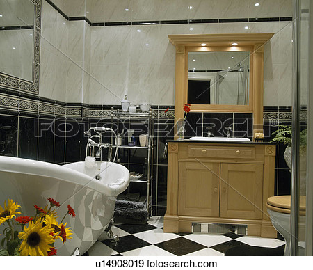 Bathroom With Fitted Mirror Above Basin In Pale Wood Vanity Unit View