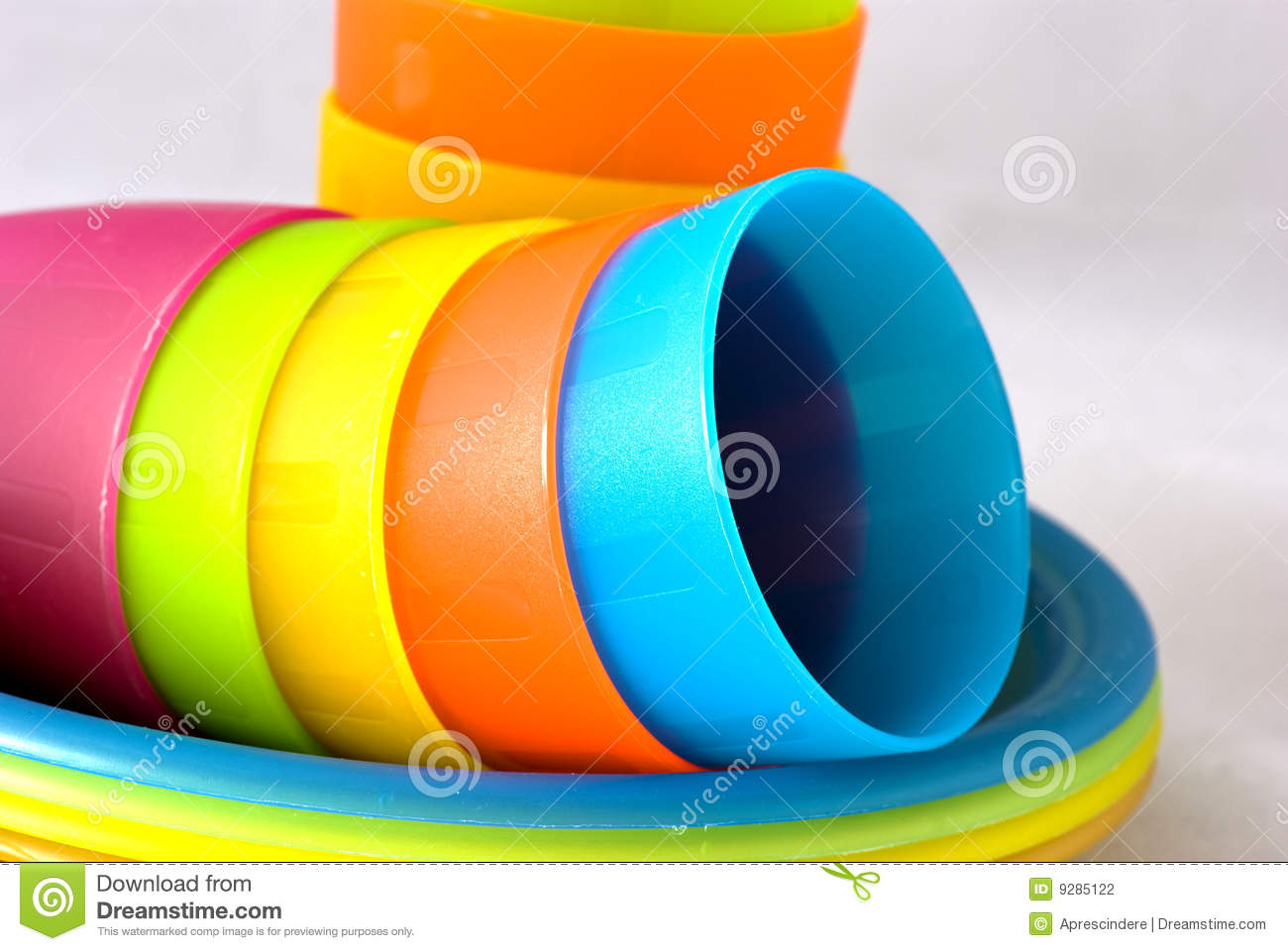 Stack Of Plastic Cups And Plates For Picnic Or Children Meal