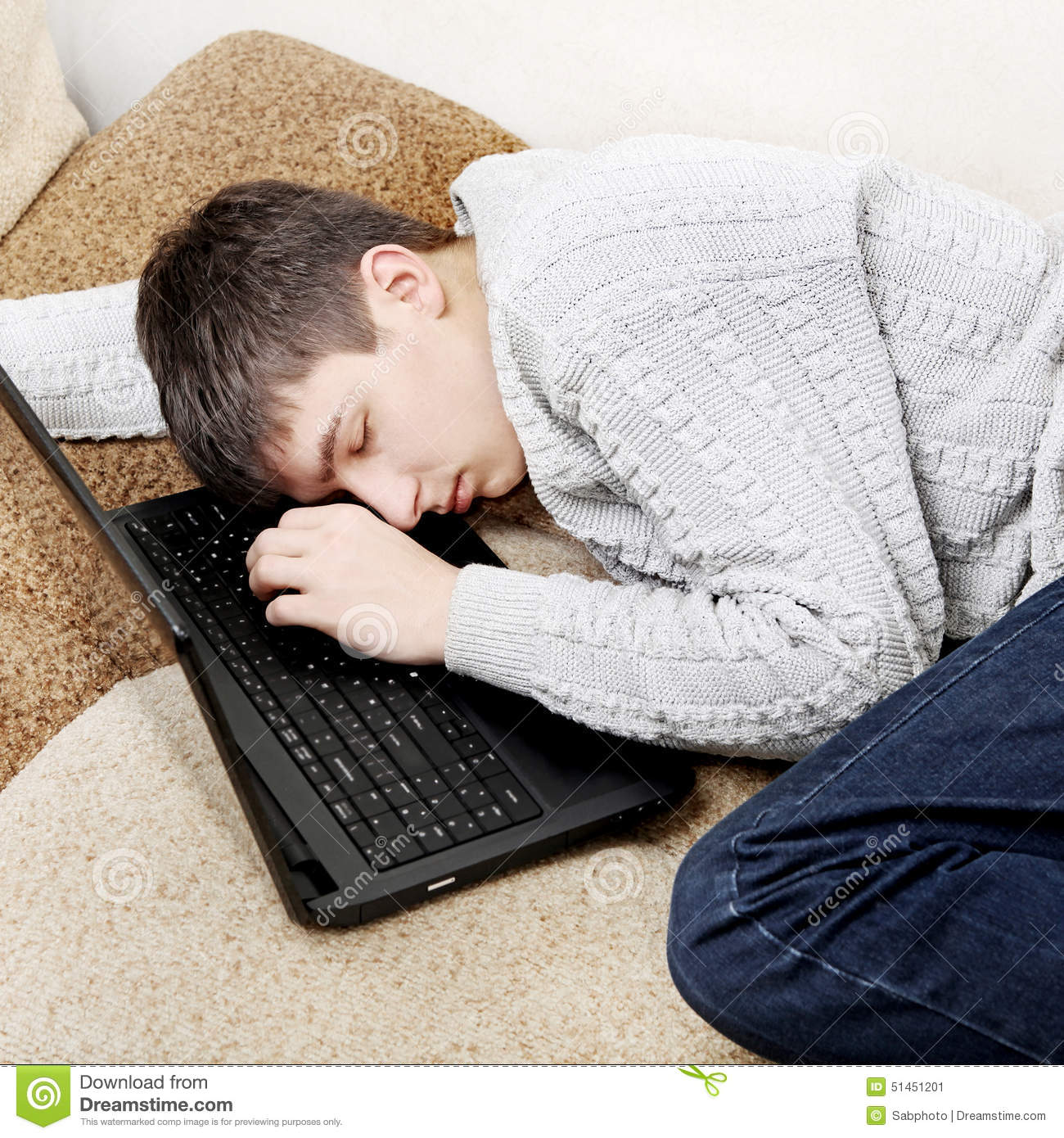 Tired Teenager Sleep With Laptop On Sofa