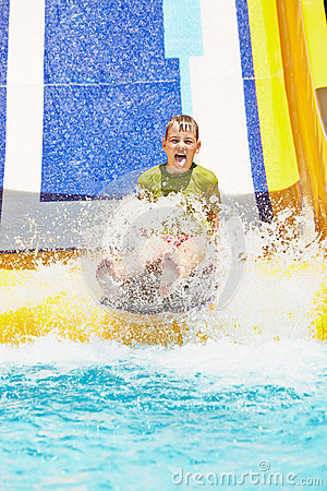 Boy Shouts While Slides Down Water Slide Stock Image   Image  32223851