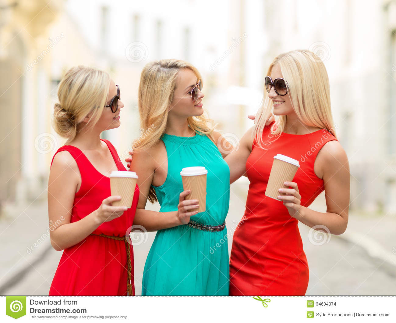 Girls Concept   Beautiful Women With Takeaway Coffee Cups In The City