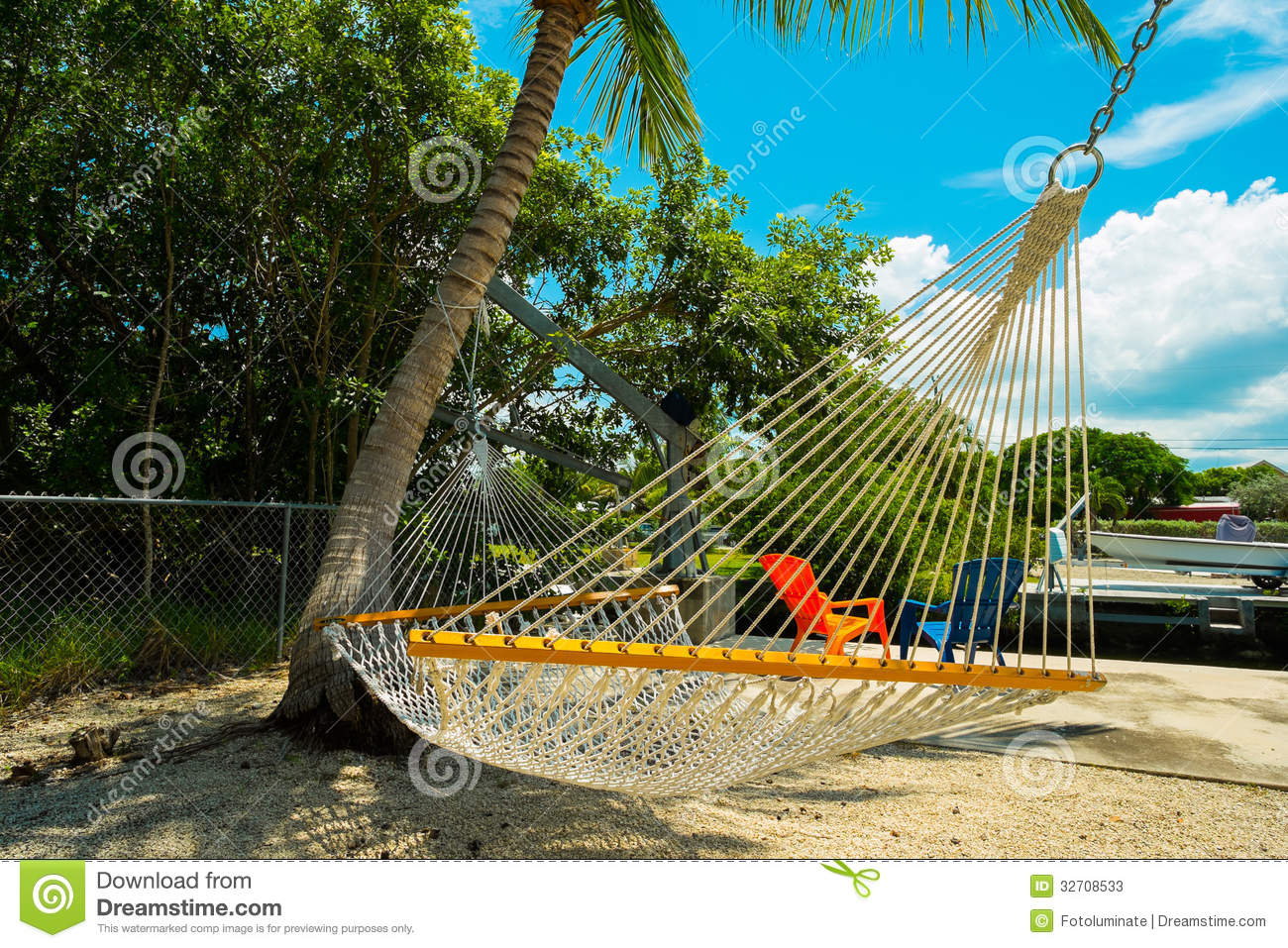 Hammock Hanging From A Palm Tree In The Backyard Of A Florida Keys