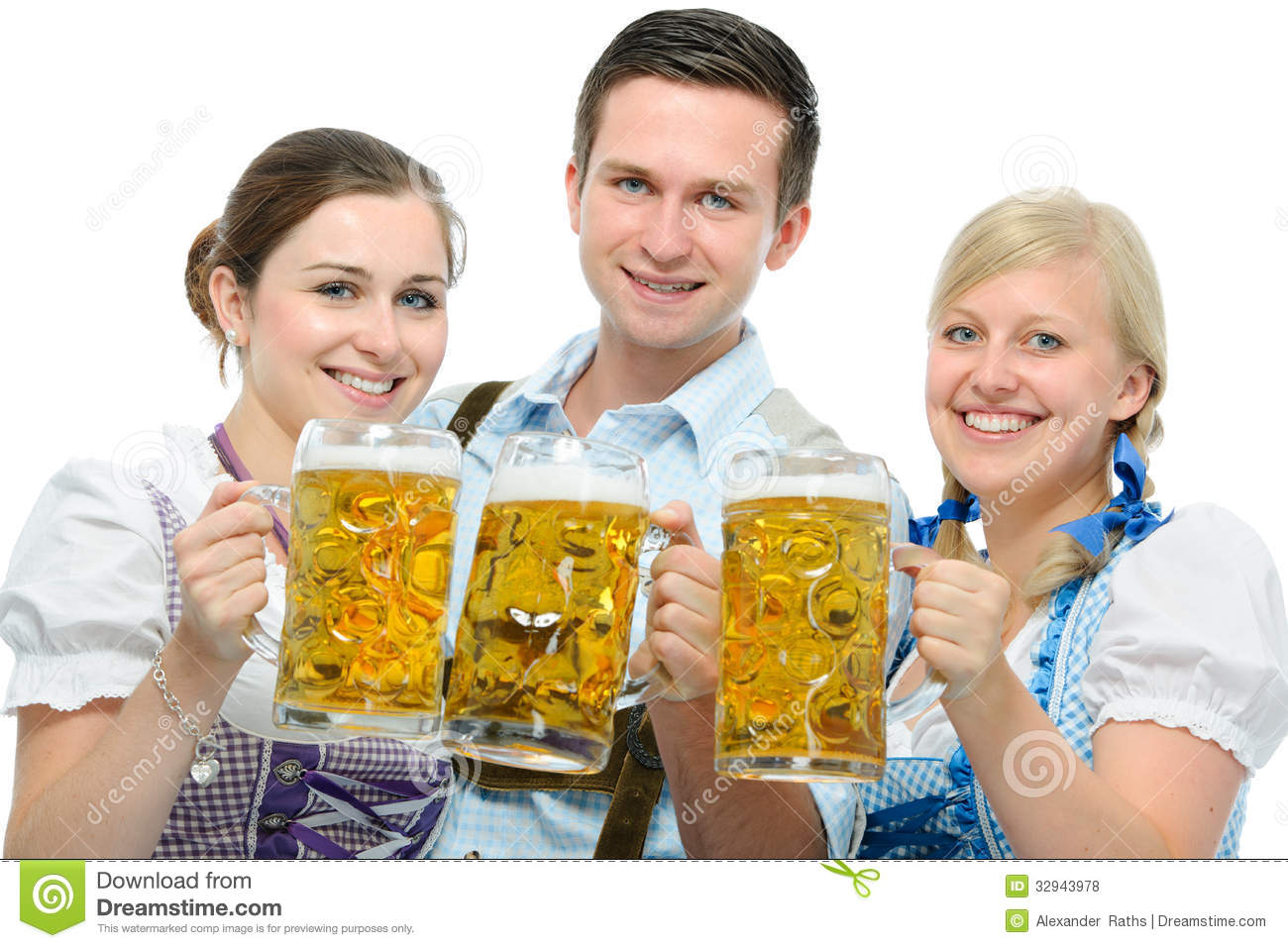 People In Traditional Bavarian Tracht Holding Oktoberfest Beer Steins