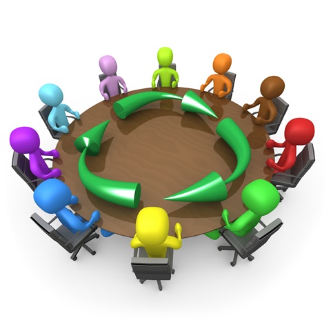Of A Diverse And Colorful Group Of People Seated And Holding A Meeting