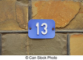 Number 13   House Number Thirteen Sign On Stone Wall