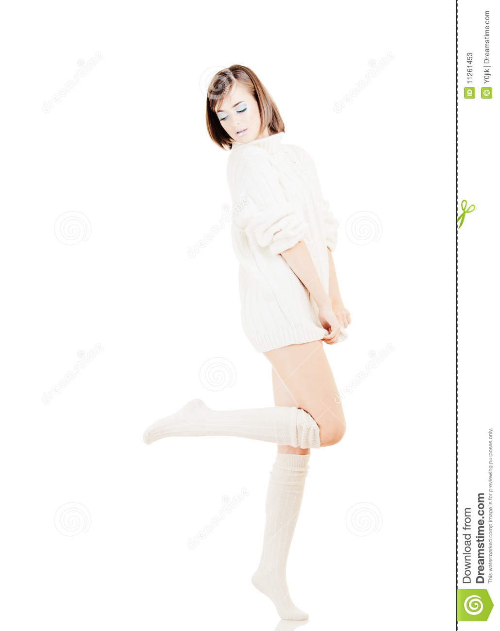 Young Pretty Girl In White Sweater On White Background
