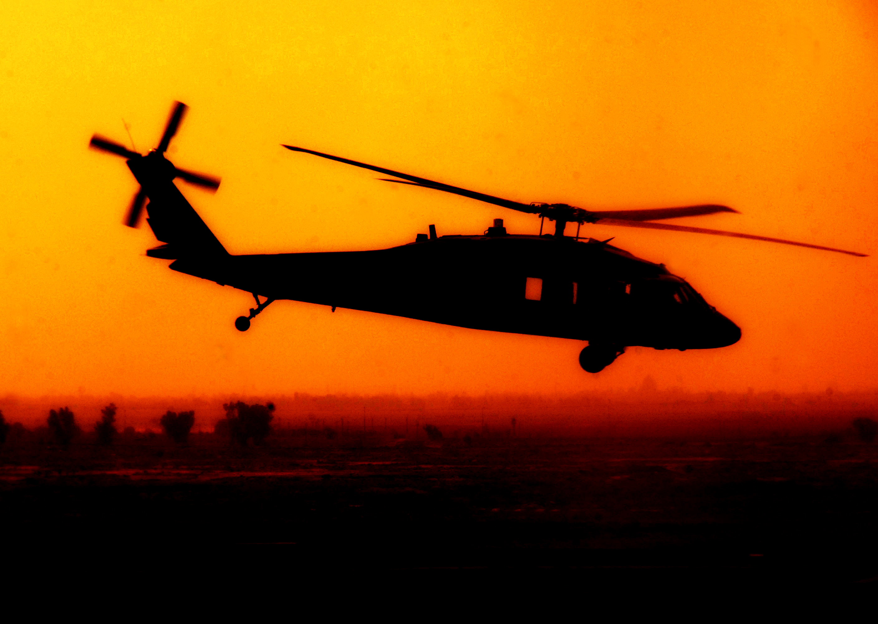 Black Hawk Helicopter Flying Over Baghdad   Acclaim Stock Photography