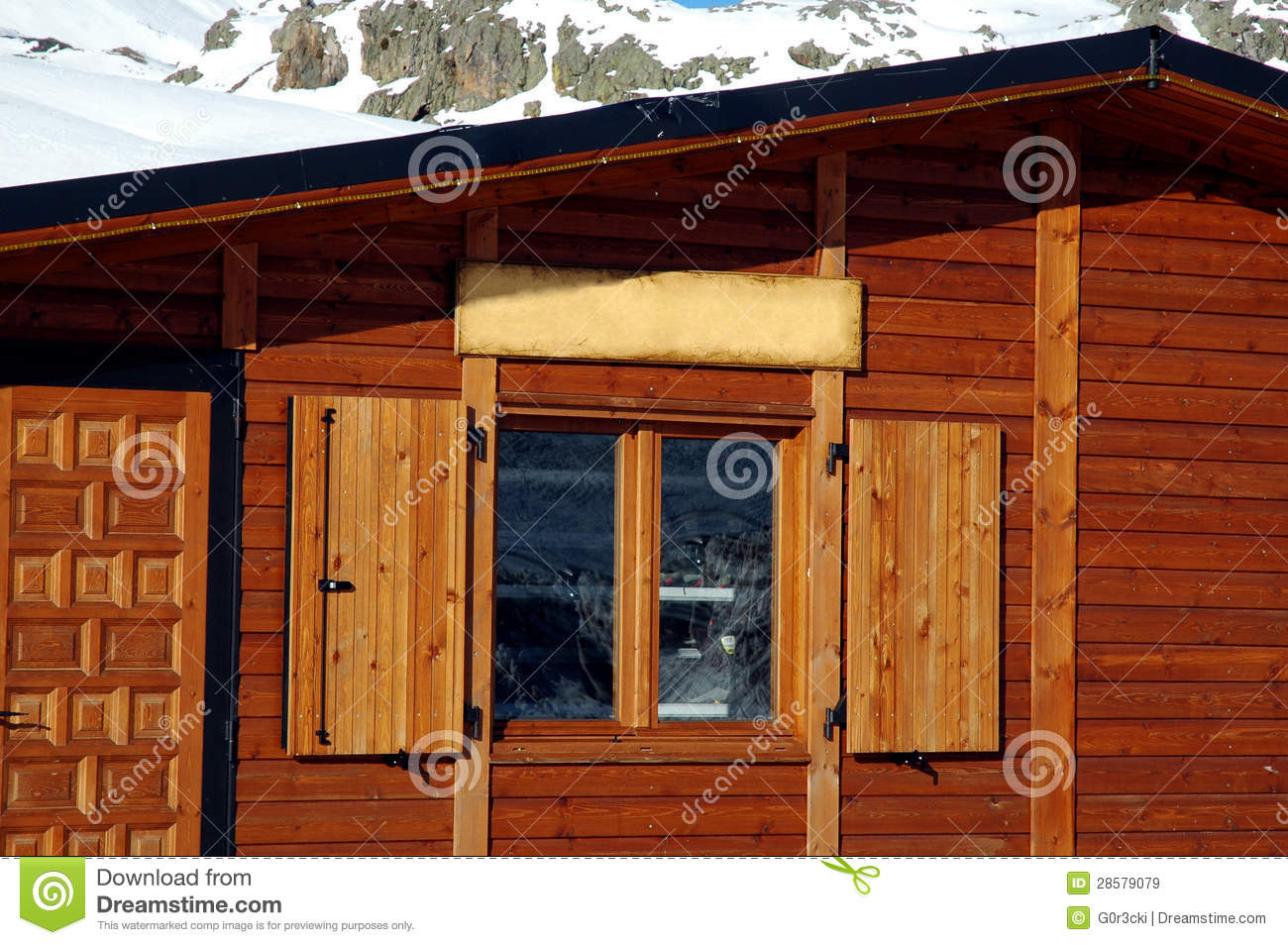 Log Cabin Window With Snowy Mountains Reflex On A Sunny Day  Spanish