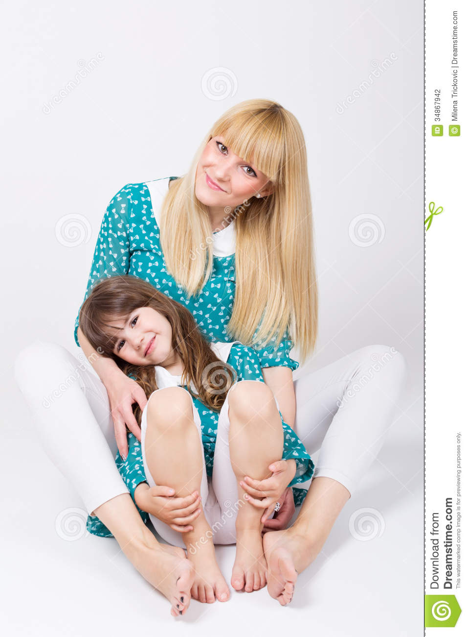 Beautiful Young Caucasian Blonde Mom And Cute Little Daughter Hugging
