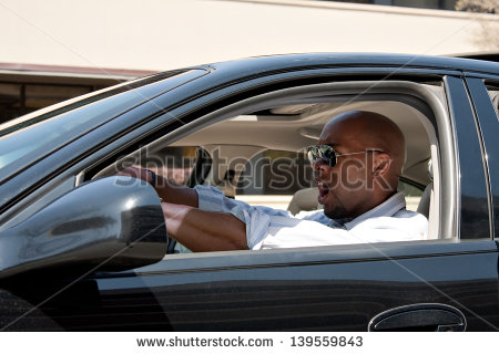 Man Driving A Car Is Expressing His Road Rage And Anger    Stock Photo