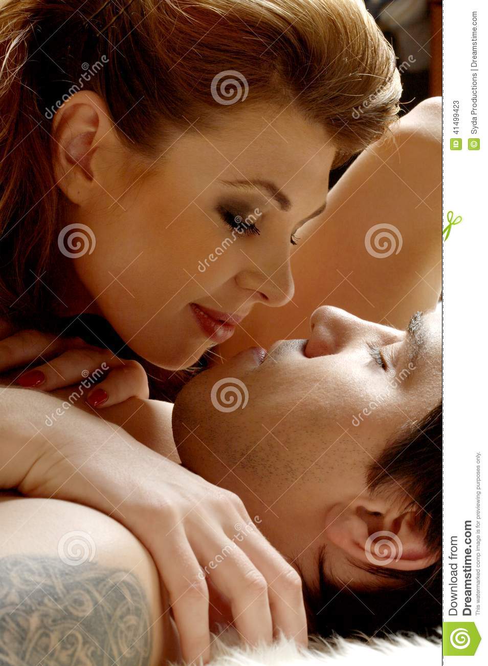 Picture Of Sweet Couple Cuddling In Bed 